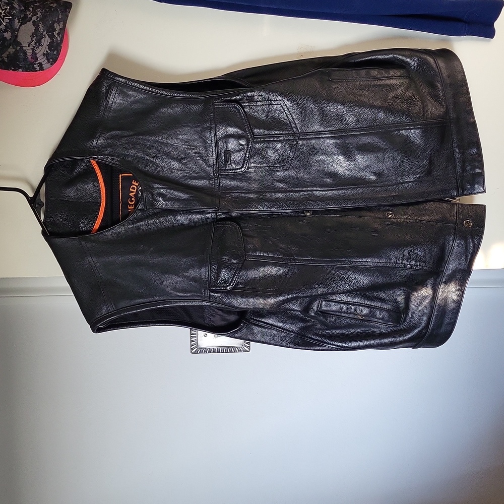 Black leather biker vest, gun pocket